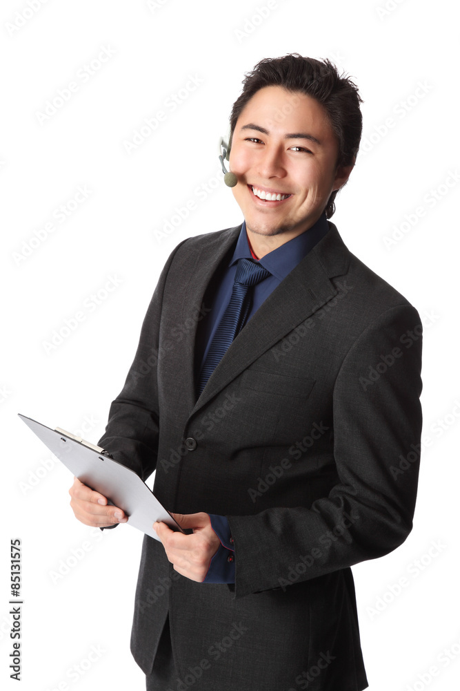 Businessman with headset and clipboard in a suit Businessman with headset and clipboard in a suit