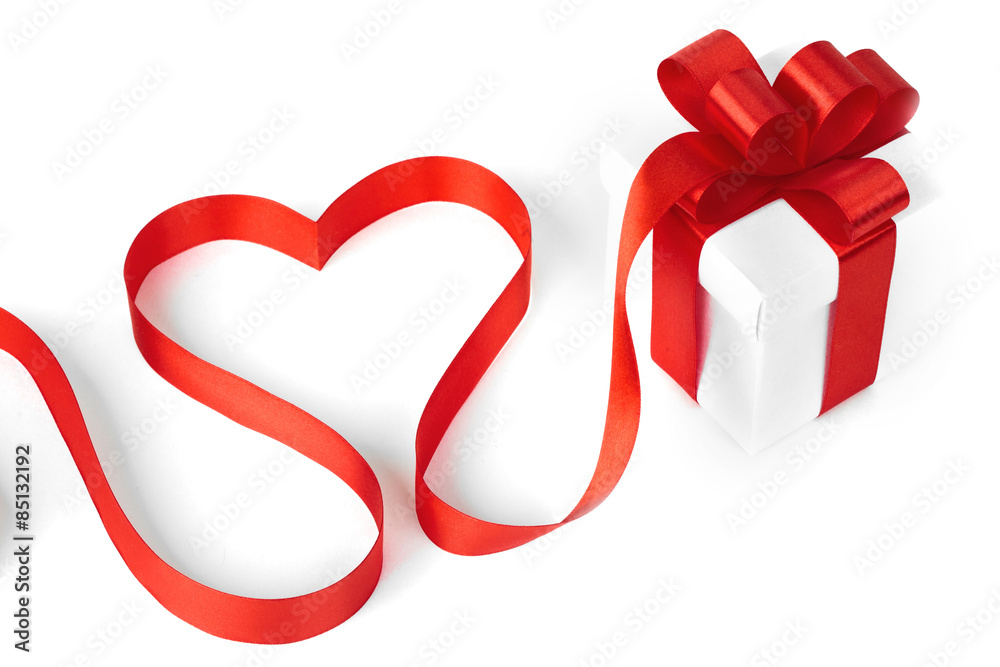 White boxes with red ribbons and decorative heart White boxes with red ribbons and decorative heart