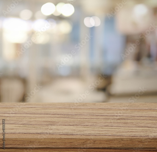Empty table and blurred store with bokeh background
