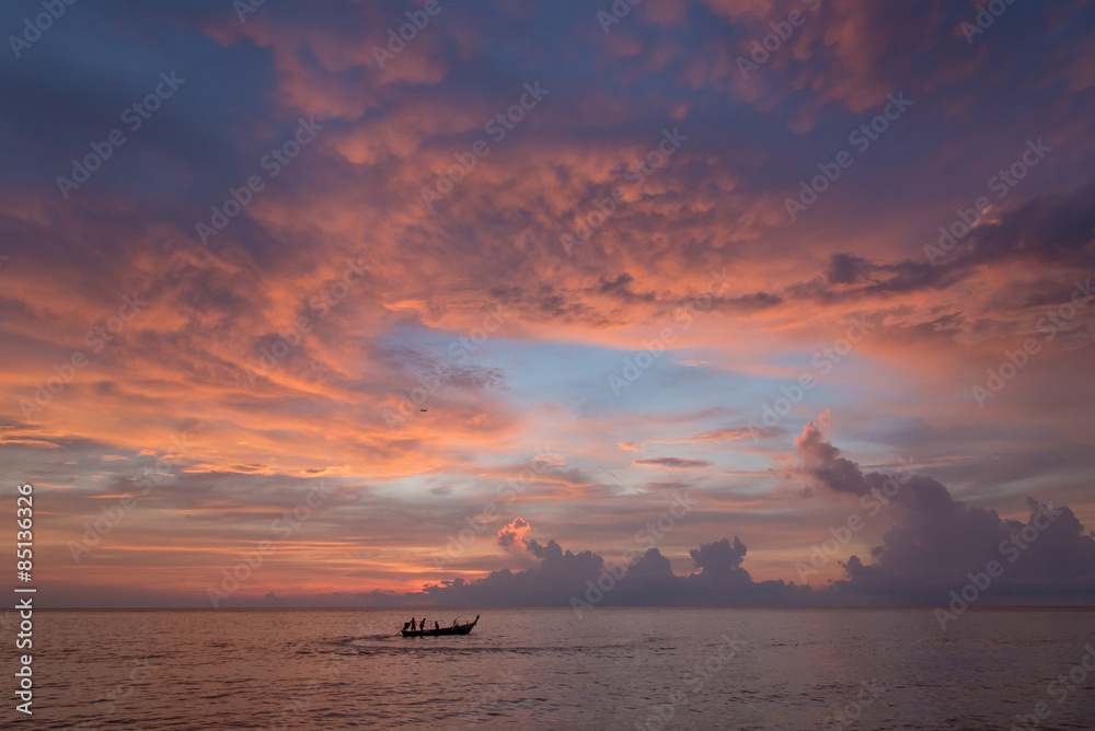 Sunset sky and fisherman
