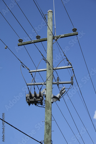 Electricity post with clear blue sky