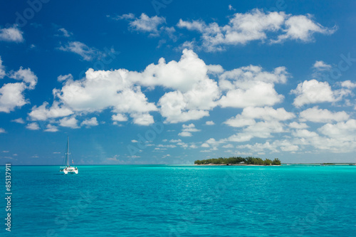 Image of blue sea and a sail boat