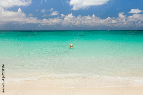Tourist swimming in an empty sea
