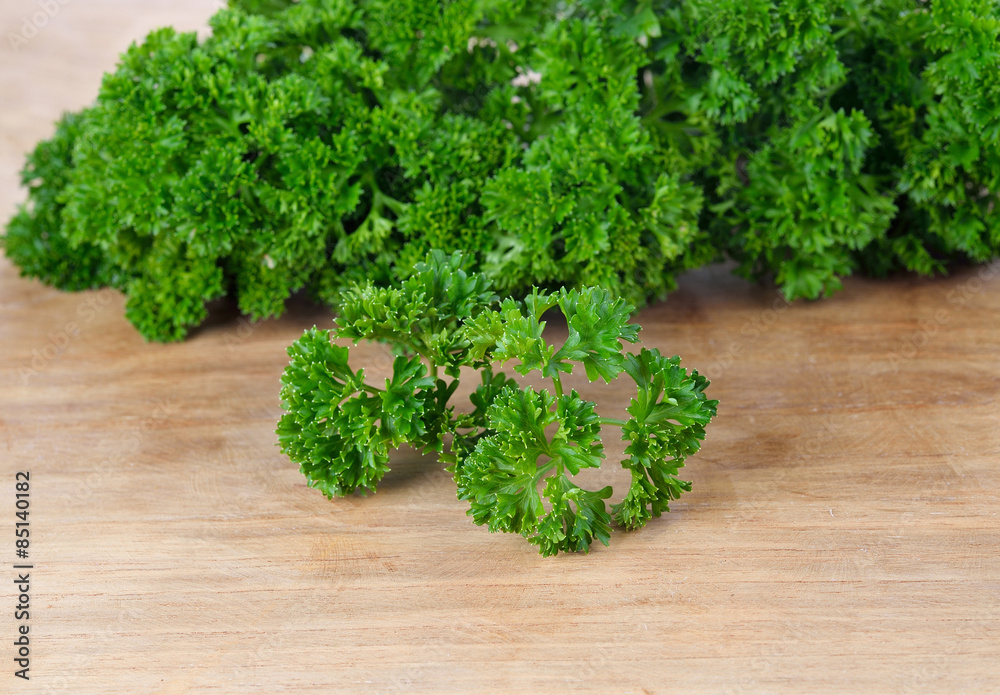 Fresh parsley on wood background Fresh parsley on wood background