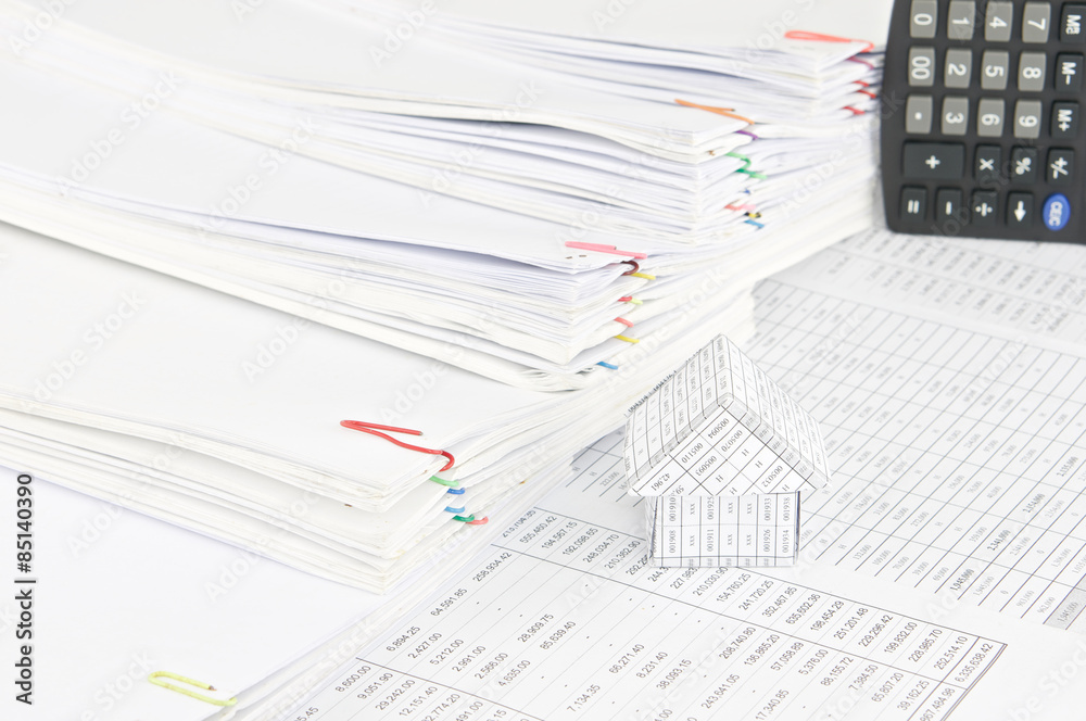 House with step pile of paperwork as background House with step pile of paperwork as background