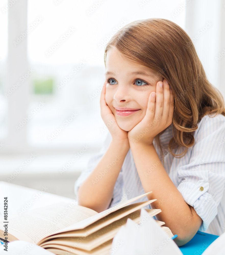 student girl writing in notebook at school student girl writing in notebook at school