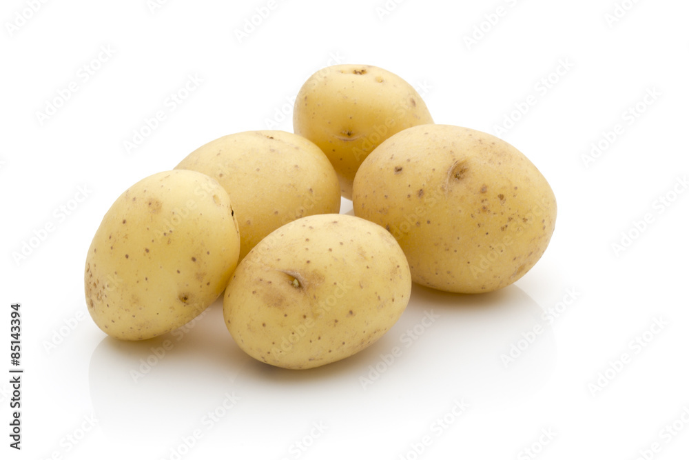 Potatoes on the white background. New harvest. Potatoes on the white background. New harvest.
