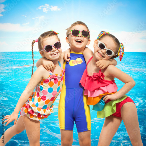 Happy kids in swimsuit at sea