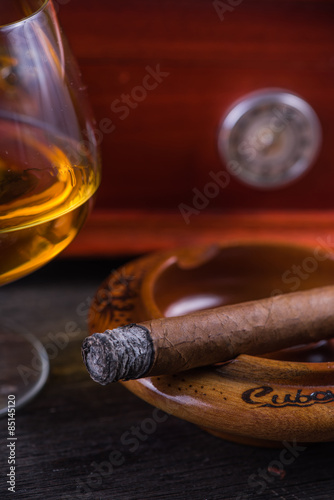 Cuban cigar,humidor and rum © marcin jucha