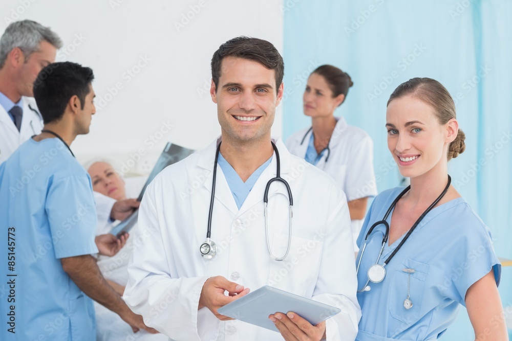 Report reading with colleagues and patient behind Report reading with colleagues and patient behind