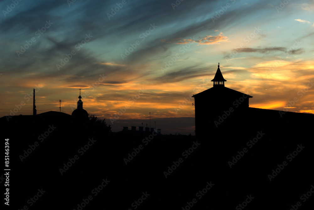 silhouette of old town and fortress tower at sunset silhouette of old town and fortress tower at sunset