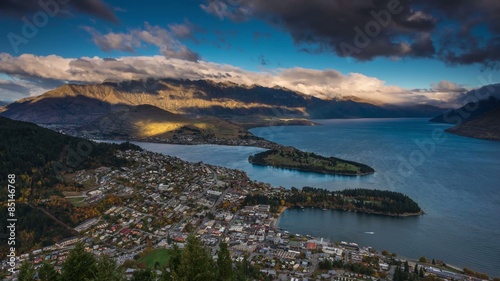 Day to Night Sunset Time Lapse over Queenstown, New Zealand. High Angle View