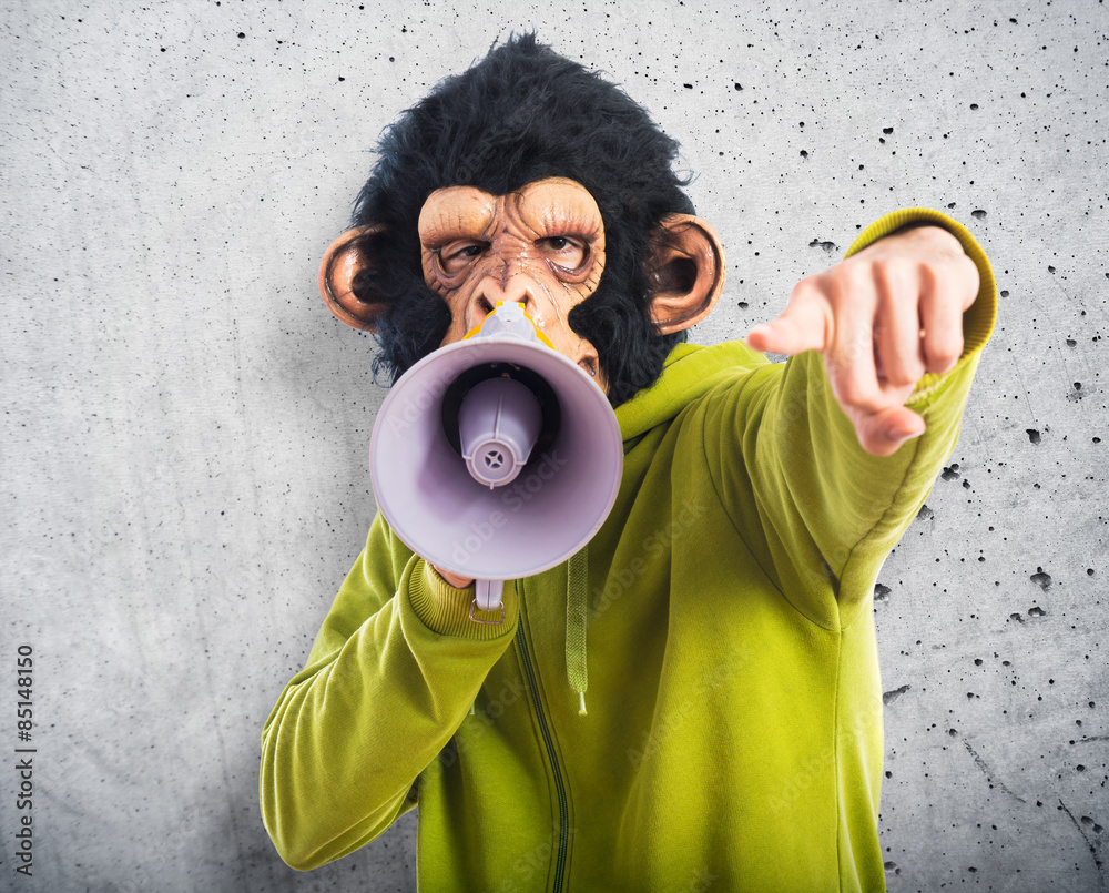 Fototapeta premium Monkey man shouting by megaphone
