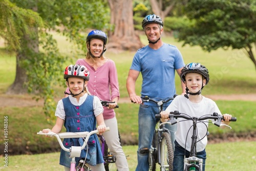Happy family on their bike at the park 