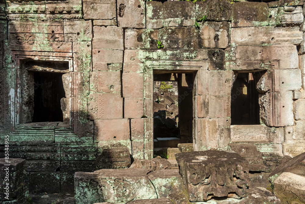 windows and door in a building in ruins in the archaeological enclosure of preah khan, siam reap, cambodia