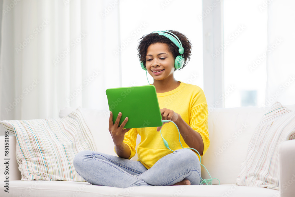 happy african woman with tablet pc and headphones happy african woman with tablet pc and headphones