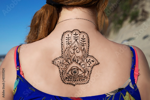 henna tattoo mehendy painted on back hamsa photo