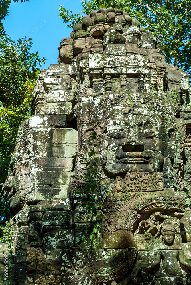 faces of the lokeshvara in a gopura of the archaeological place of ta som in siam reap cambodia