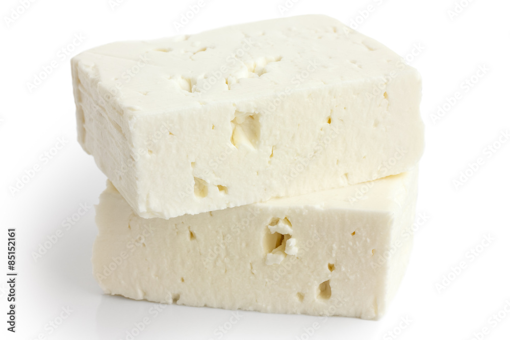 Greek feta cheese block isolated on white.