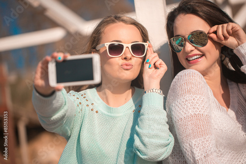 Two girls taking selfie