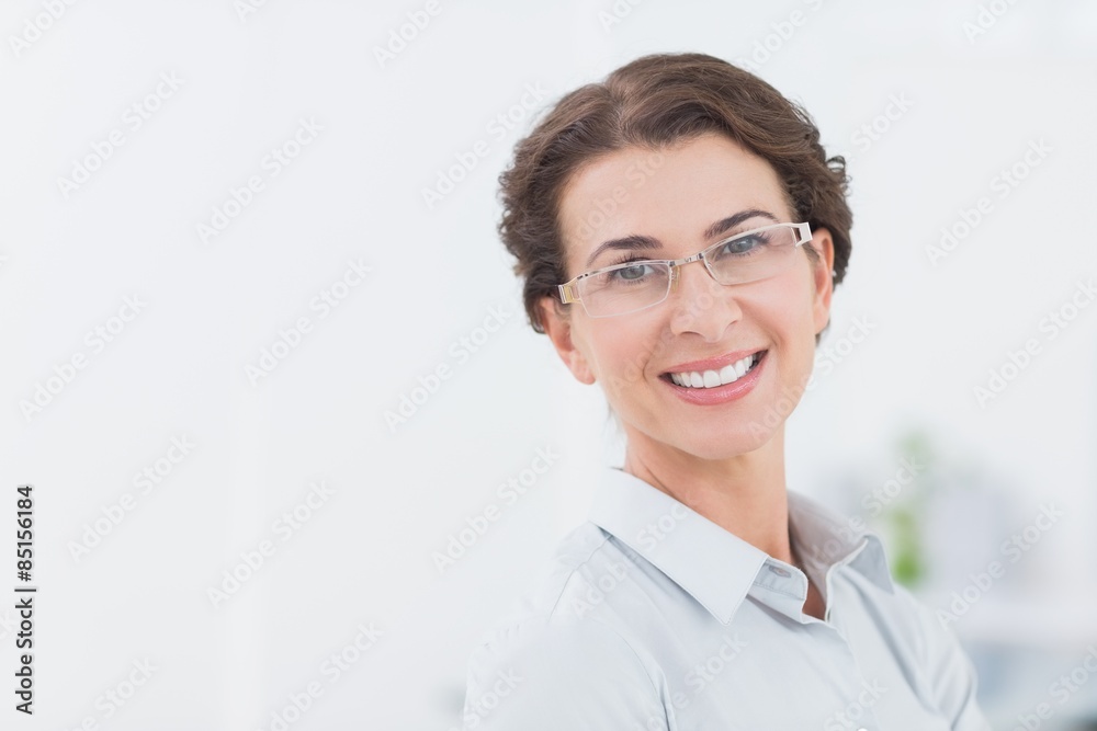 Smiling businesswoman looking at camera