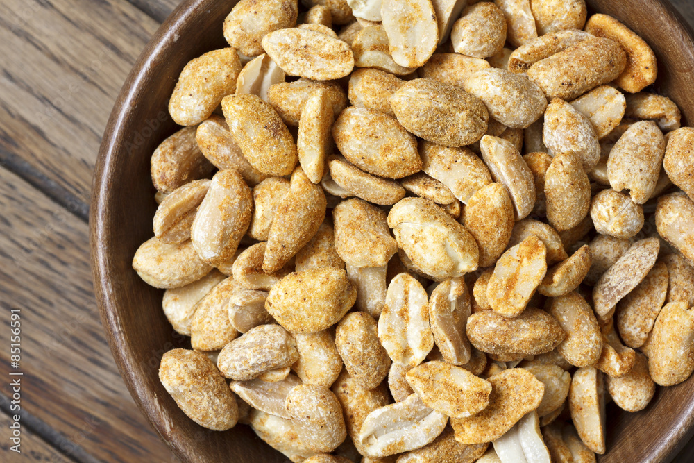 Rustic spicy dry roasted peanuts detail from above. Rustic spicy dry roasted peanuts detail from above.