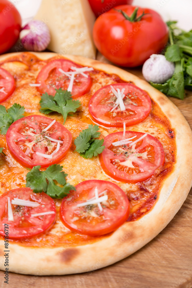 hot pizza with garnish and components hot pizza with garnish and components