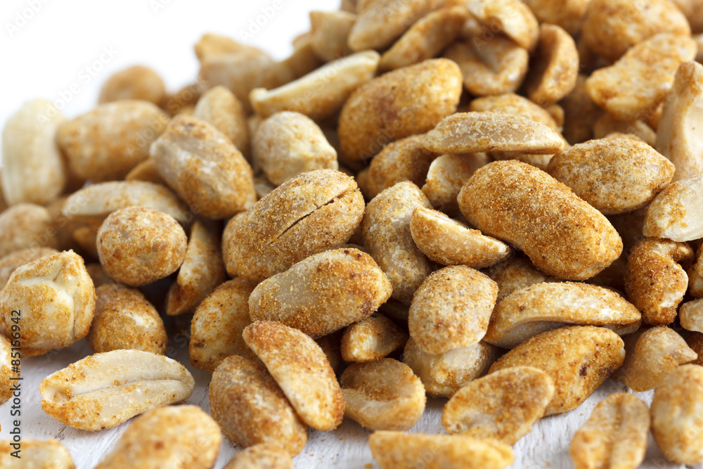 Spicy dry roasted peanuts detail in perspective. Spicy dry roasted peanuts detail in perspective.