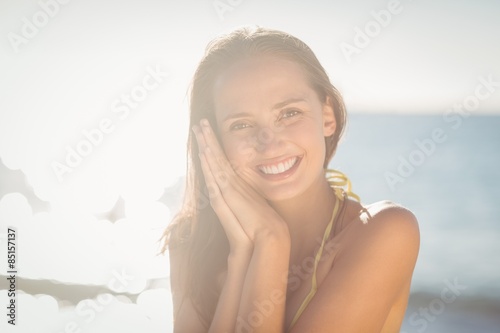 Brunette relaxing and smiling at camera