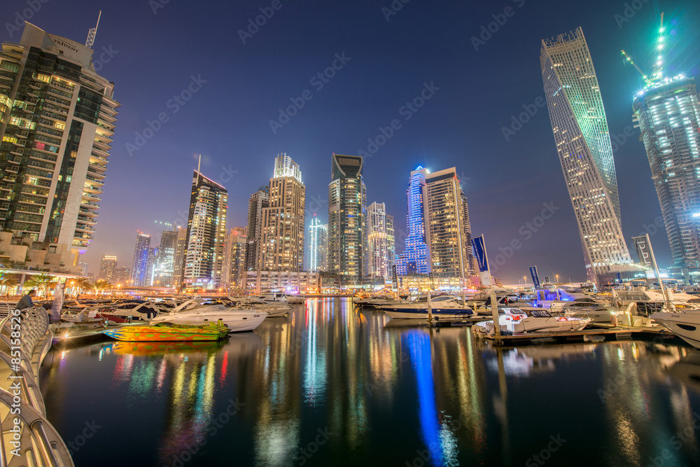 Dubai marina skyscrapers during night hours Dubai marina skyscrapers during night hours
