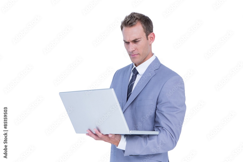 Handsome businessman using laptop computer Handsome businessman using laptop computer