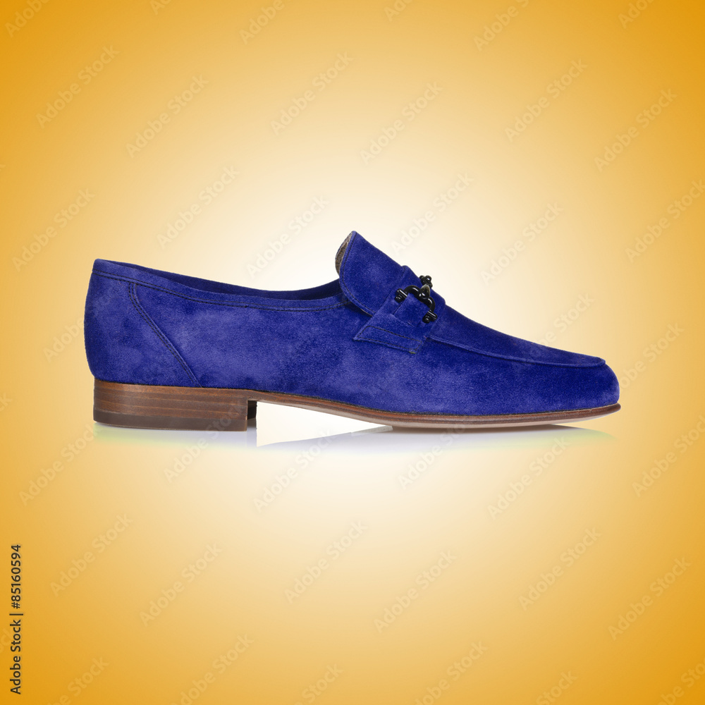 Fashion concept with male shoes against gradient 