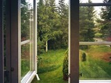open window looking out on summer rainstorm