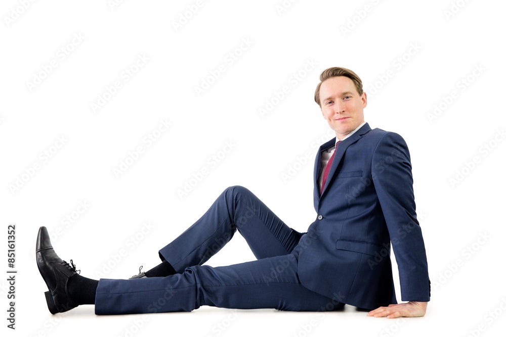Businessman looking at camera on the floor Businessman looking at camera on the floor