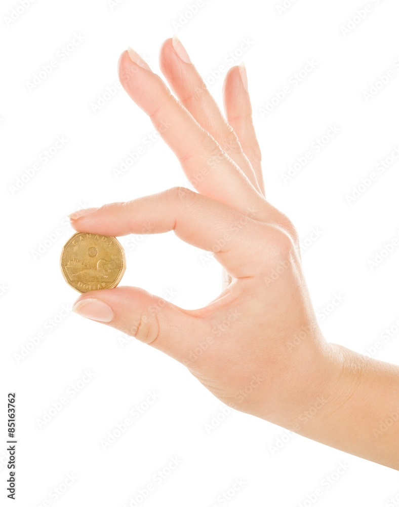 Woman hand with coin isolated on white Woman hand with coin isolated on white