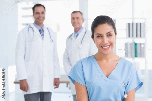 Nurse and doctors smiling at camera 