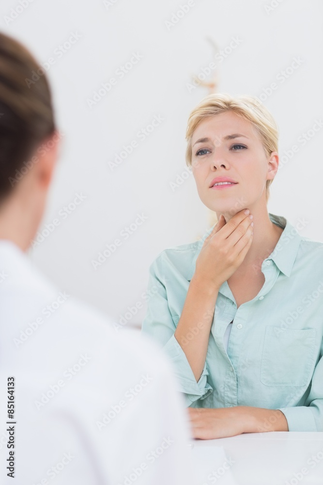 Fototapeta premium Patient with sore throat visiting doctor 