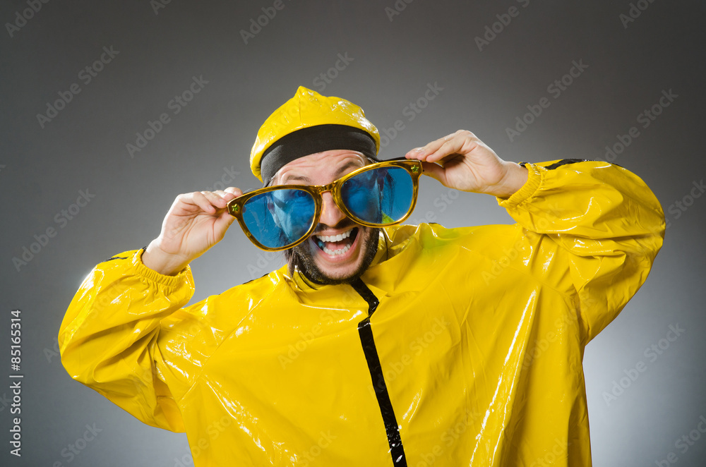 Man wearing yellow suit in funny concept