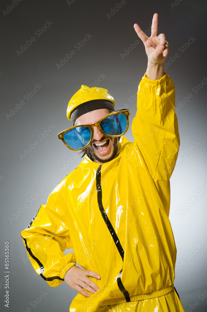 Man wearing yellow suit in funny concept