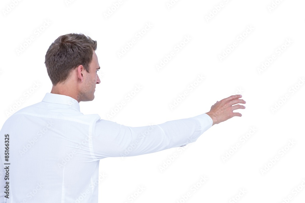 Rear view of businessman showing something with his hand Rear view of businessman showing something with his hand