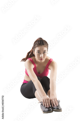 asian young woman wearing pink and black fitness outfit on white 