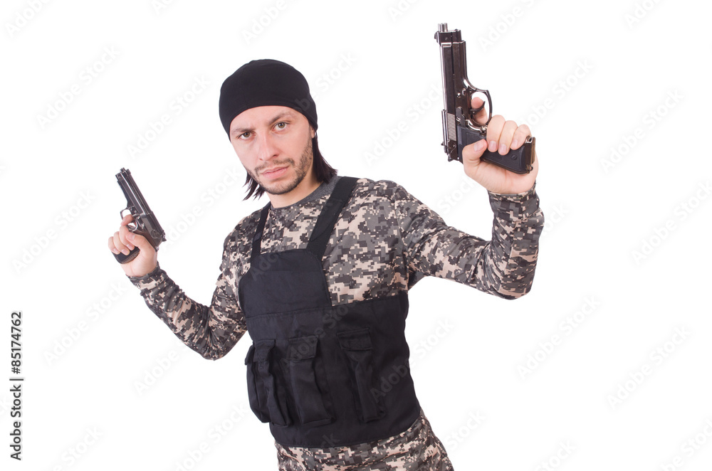 Young man in military uniform holding gun isolated on white Young man in military uniform holding gun isolated on white
