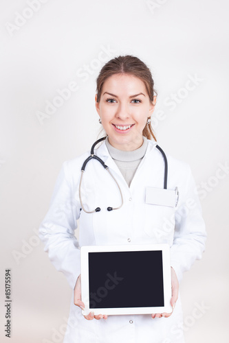 Nurse holding a tablet with free text space