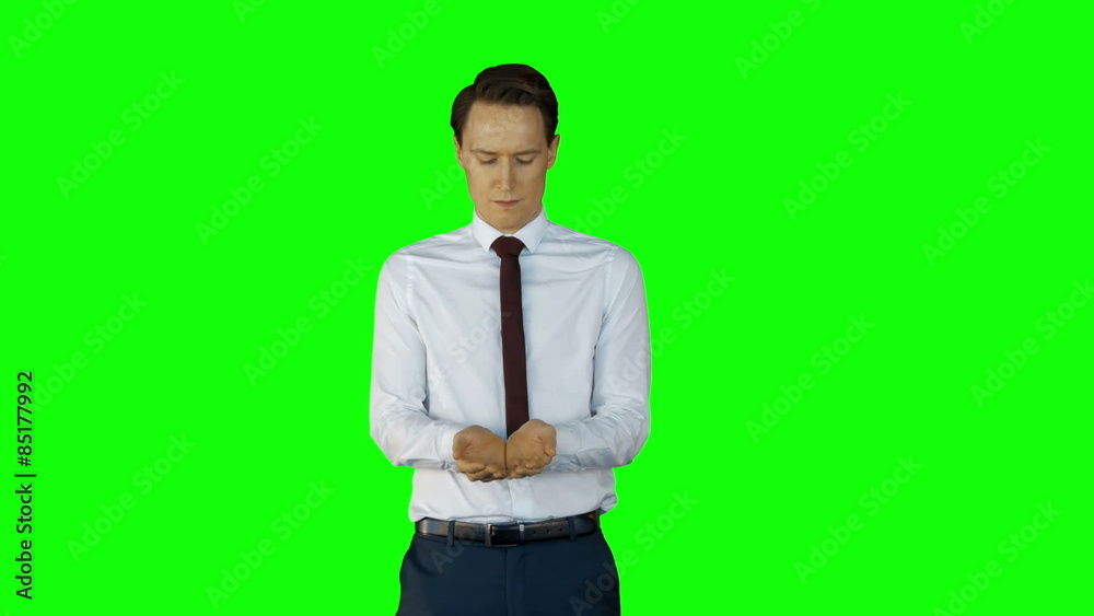 Businessman wearing something with his hands on green screen Businessman wearing something with his hands on green screen