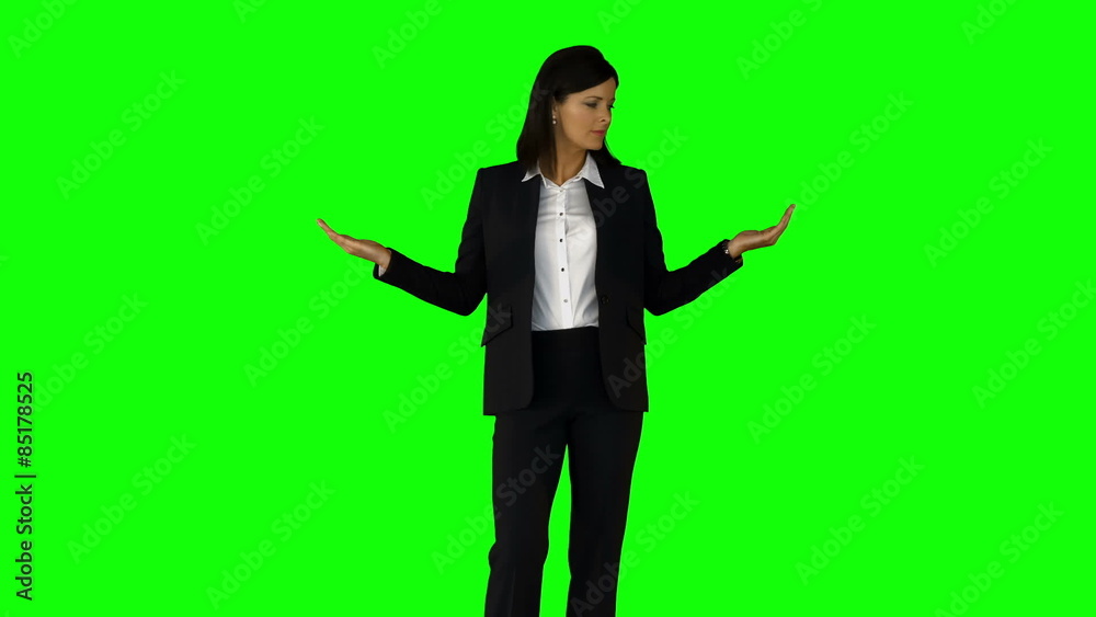 Businesswoman wearing something with her hands on green screen Businesswoman wearing something with her hands on green screen