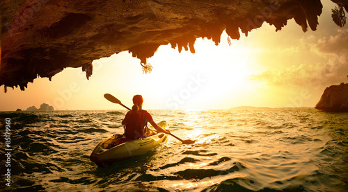 Photos Young lady paddling the kayak