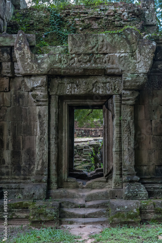 door with bas-reliefs of the royal palace in the archaeological angkor thom place in siam reap cambodia