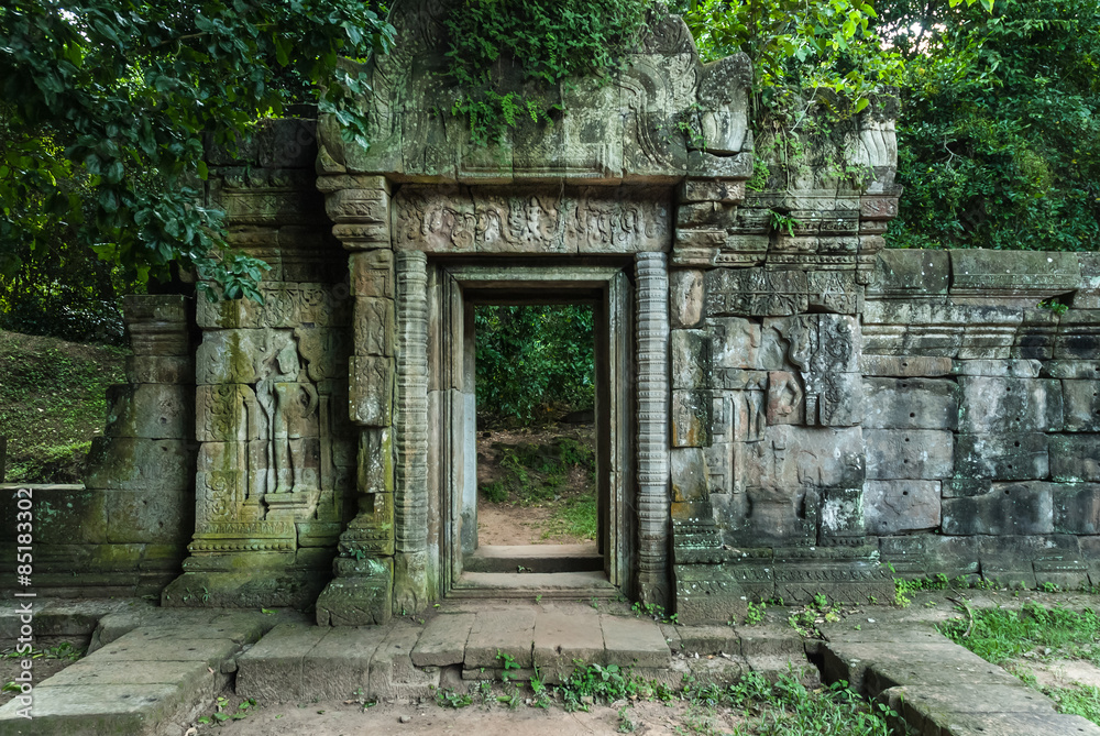 door with bas-reliefs of the royal palace in the archaeological angkor thom place in siam reap cambodia door with bas-reliefs of the royal palace in the archaeological angkor thom place in siam reap cambodia
