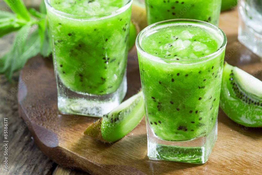 Fresh green smoothie with kiwi, cucumber, selective focus Fresh green smoothie with kiwi, cucumber, selective focus