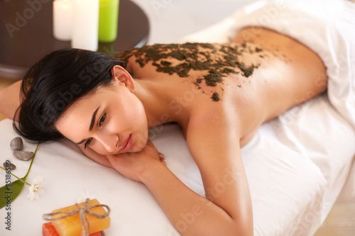 Woman Gets a Marine Algae Wrap Treatment in Spa Salon